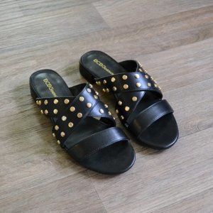 NWOB BCBGeneration Dana Edgy Studded Black and Gold Leather Sandal Size 6.5